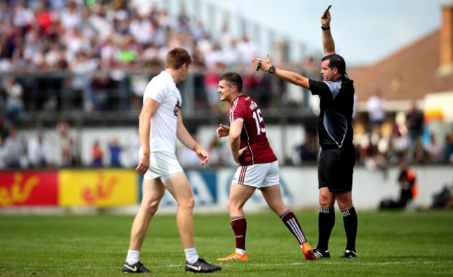 Eamonn Brannigan is black carded by Referee Sean Hurson