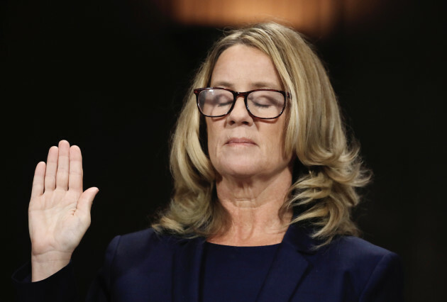 Christine Blasey Ford is sworn in before testifying to the Senate Judiciary Committee on Capitol Hill in Washington