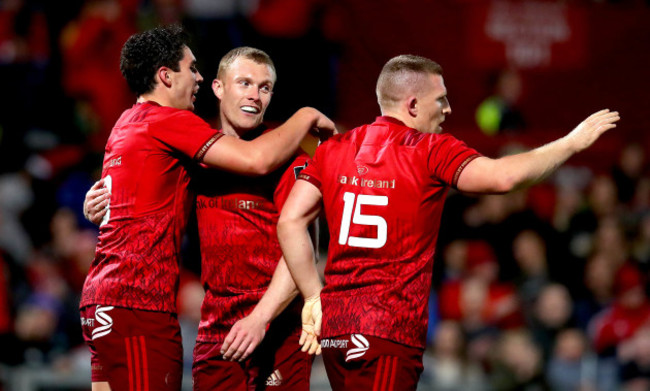 Joey Carbery celebrates scoring a try with Andrew Conway and Keith Earls