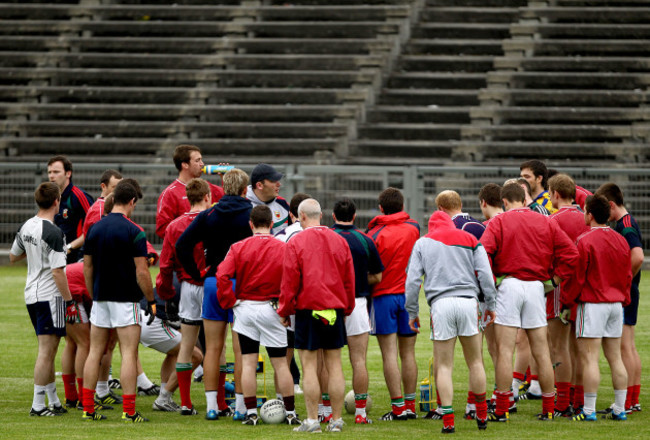 Manager James Horan speaks to his team during traininig