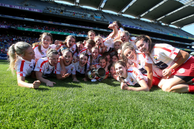 Cork team celebrate after the game with the Jack McGrath Cup
