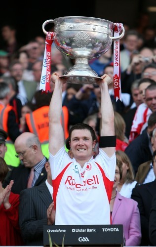 Enda McGinley lifts the Sam Maguire Cup