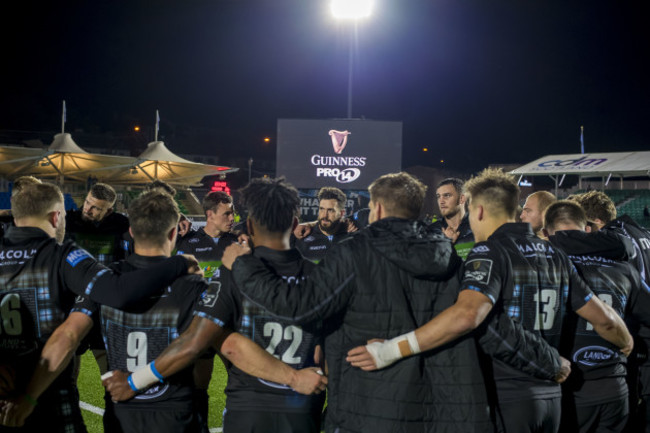 The Glasgow Warriors team huddle after the game