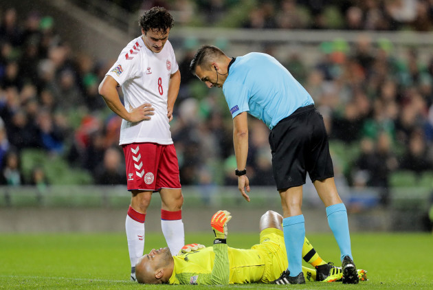 Darren Randolph receives attention after a collision with Thomas Delaney