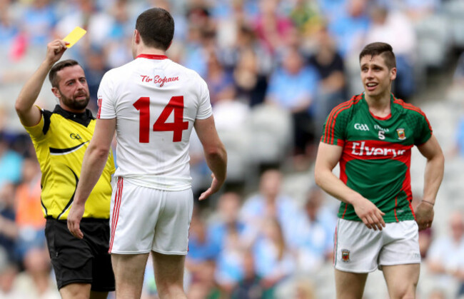 Sean Cavanagh is shown a yellow card by Referee David Gough