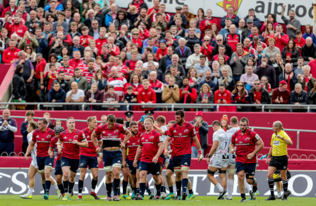 Munster players celebrate a try from Rhys Marshall