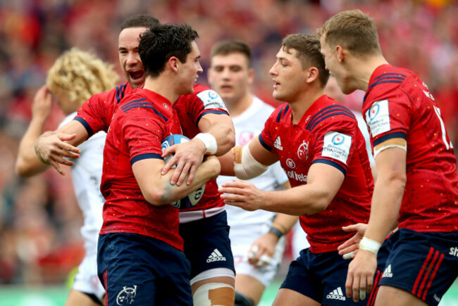 Joey Carbery celebrates his try with Alby Mathewson and Dan Goggin
