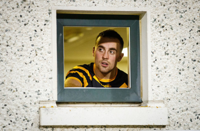 Cormac Doohan looks on from the dressing room before the game