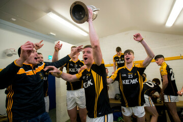 Tony Kelly celebrates after the game with Brandon O'Carroll and Sean Meaney