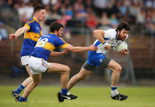 Tommy Prendergast under pressure from Jimmy Feehan and Martin Dunne