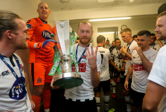 Chris Shields celebrates in the dressing room