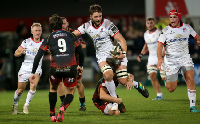 Iain Henderson is tackled by Jarryd Sage
