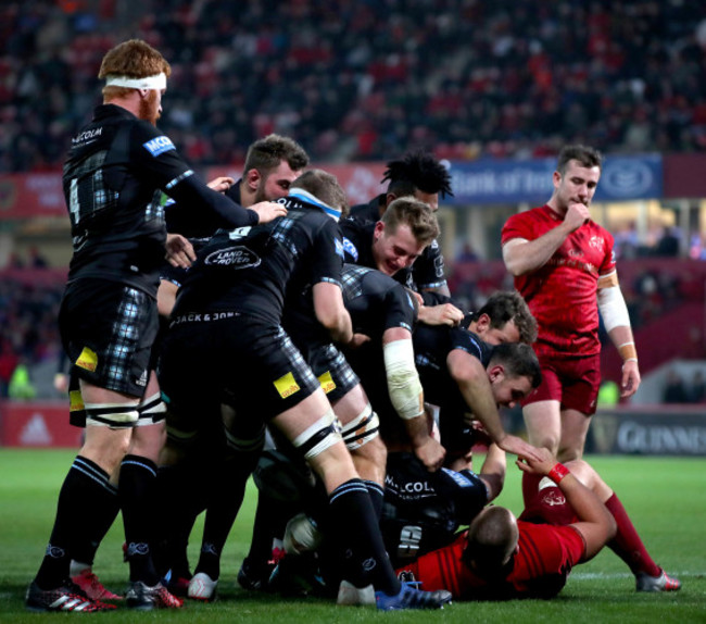 Matt Fagerson celebrates scoring a try with his teammates