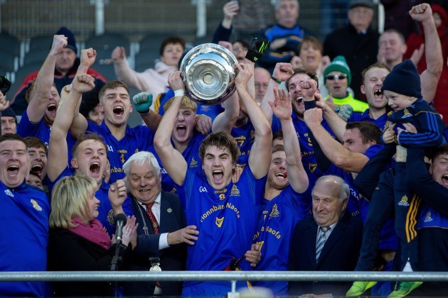 Ian Maguire lifts the trophy