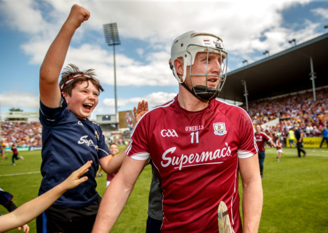 Fans celebrate with Joe Canning after the game