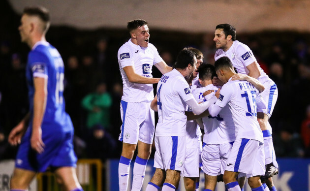 Mark Timlin celebrates scoring a goal with teammates