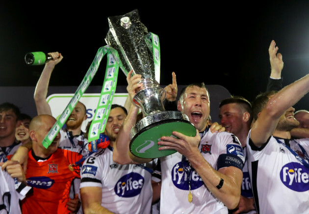 Brian Gartland lifts the trophy