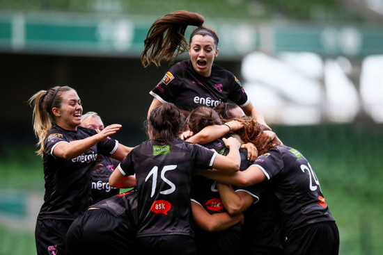 Katrina Parrock celebrates scoring a goal with teammates