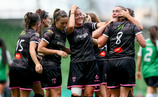 Katrina Parrock celebrates scoring a goal with teammates