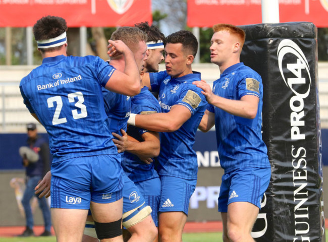 Teammates congratulate try scorer Max Deegan