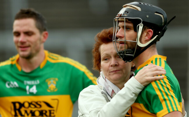 Timmy Hammersley and Conor Hammersley consoled by their mother Helen after the game