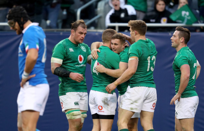 Jordan Larmour is congratulated after scoring his third try