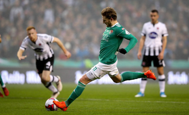 Kieran Sadlier scores his side's first goal with a penalty