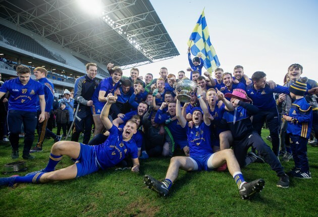 St Finbarrs players celebrate with the trophy