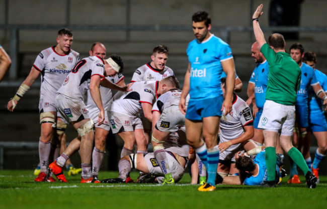 Marcus Rea celebrates his try with teammates