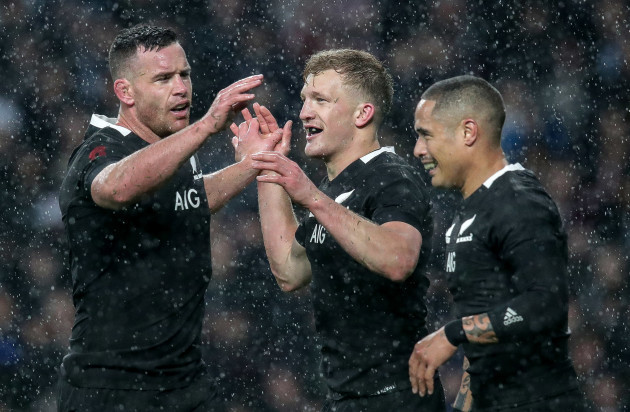 Damian McKenzie celebrates scoring his sides first try with Ryan Crotty and Aaron Smith