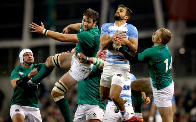 Iain Henderson and Keith Earls with Ramiro Moyano