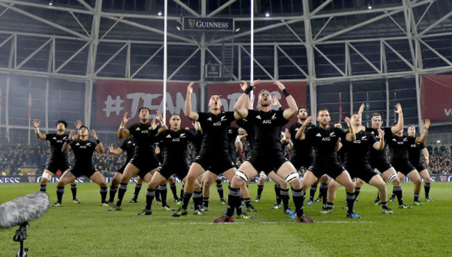 The New Zealand team perform the haka before the game