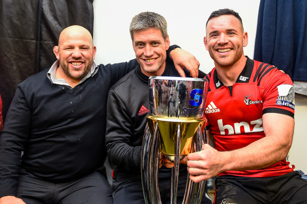 Jason Ryan and Ronan O'Gara celebrate winning the Super Rugby title with Ryan Crotty