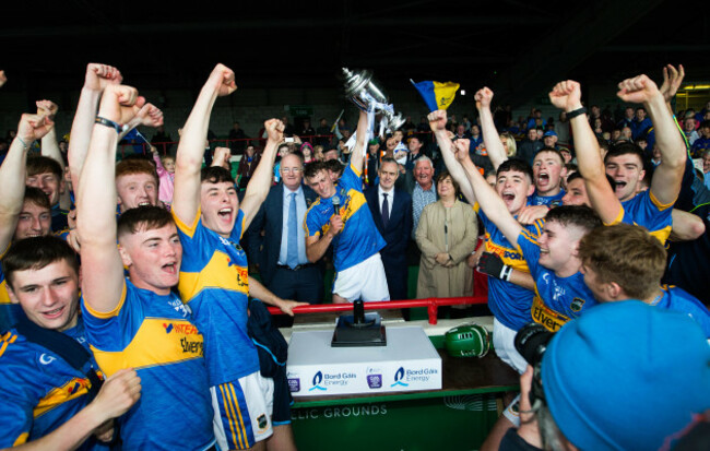 Colin English lifts the trophy