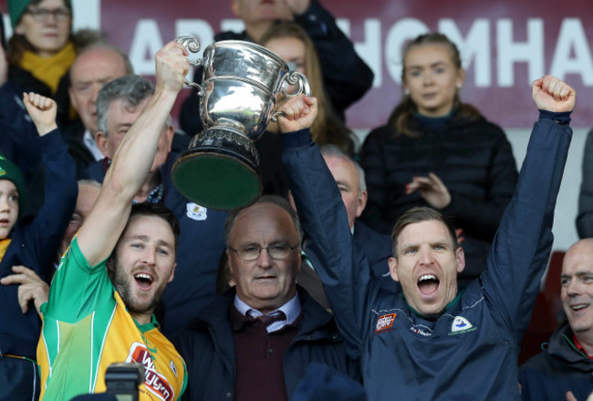 Micheal Lundy and Ciaran McGrath lift the cup