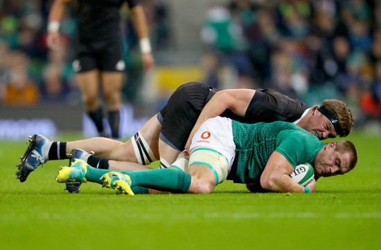 CJ Stander is tackled by Scott Barrett