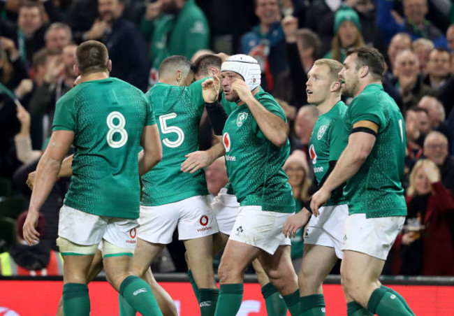 Jacob Stockdale celebrates scoring their first try with teammates