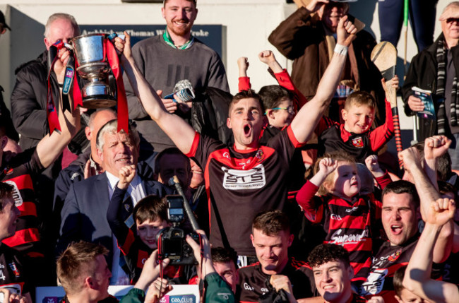 Stephen O'Keeffe raises the trophy with Shane O'Sullivan