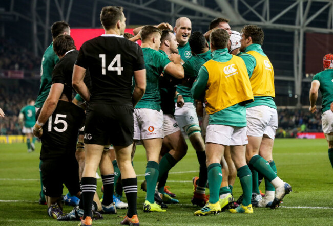 Jacob Stockdale celebrates scoring their first try with teammates
