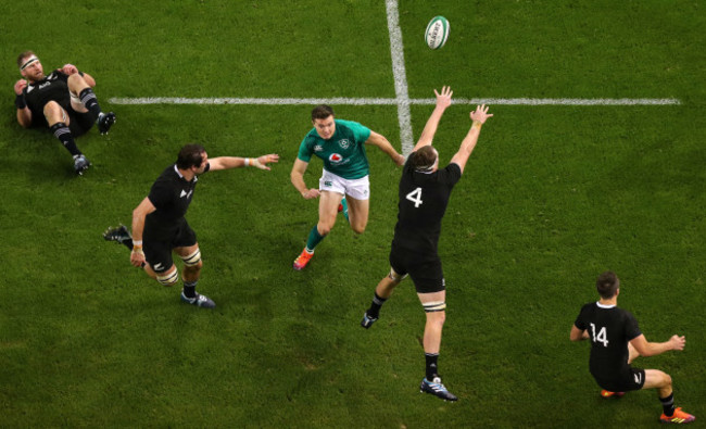 Jacob Stockdale kicks the ball forward and scores a try