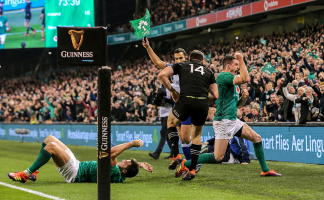 Jonathan Sexton celebrates as Ben Smith is forced into touch