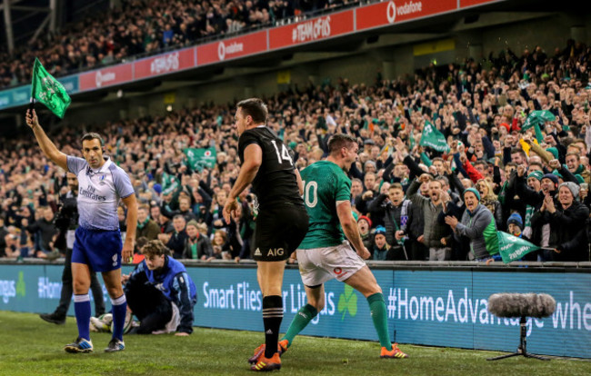 Jonathan Sexton celebrates as Ben Smith is forced into touch