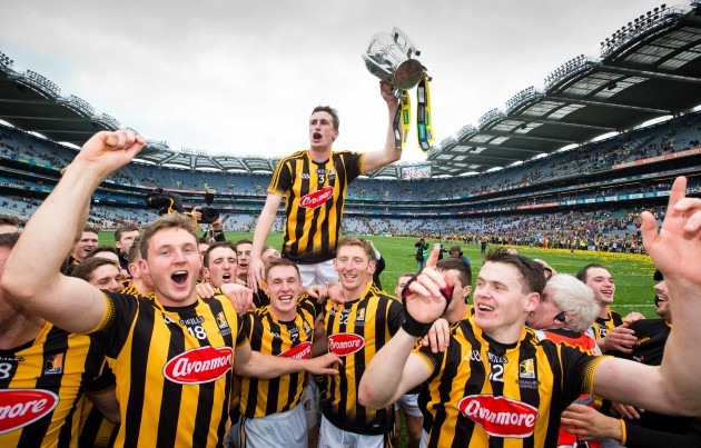 Kilkenny players lift captain Joey Holden and the Liam McCarthy Cup in celebration