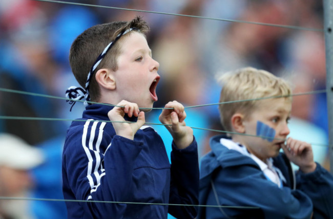 A young Dublin fan cheers on his side