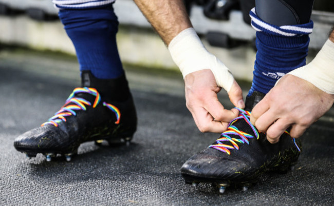 Blaine Scully ties his rainbow laces in support of Gareth Thomas