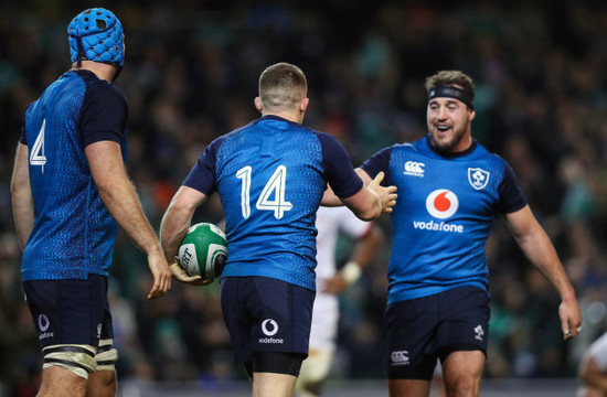 Andrew Conway celebrates his try with Rob Herring and Tadhg Beirne