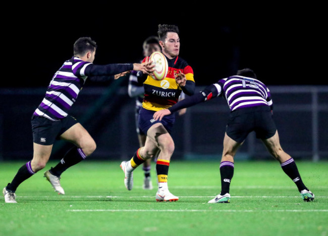 Tom Roche tackled by Matt Byrne and Harry Moore