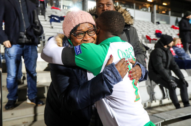 Michael Obafemi hugs his mother Bola after the game