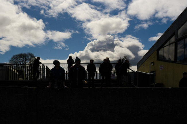 Fans look on during the game