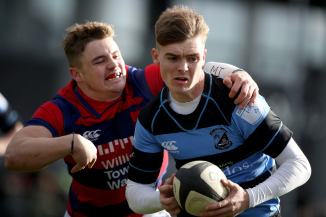 Jake Flannery is tackled by Michael Courtney